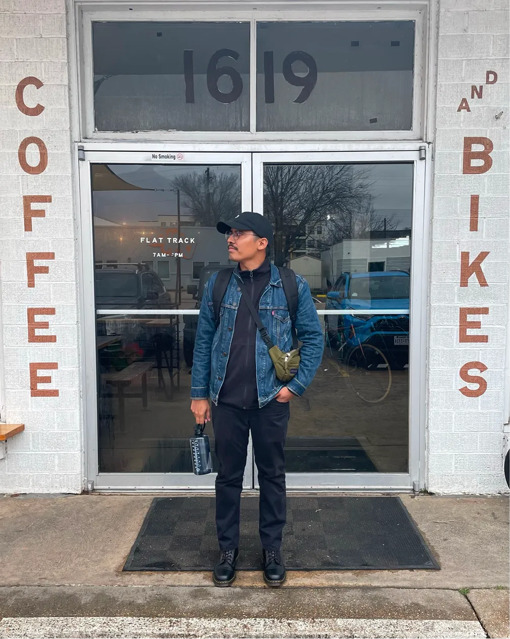 Javier Zapien outside a Coffee and Bikes storefront